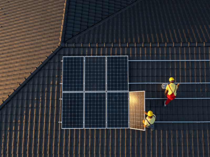 OBST solar installation team, installing solar panels for a client